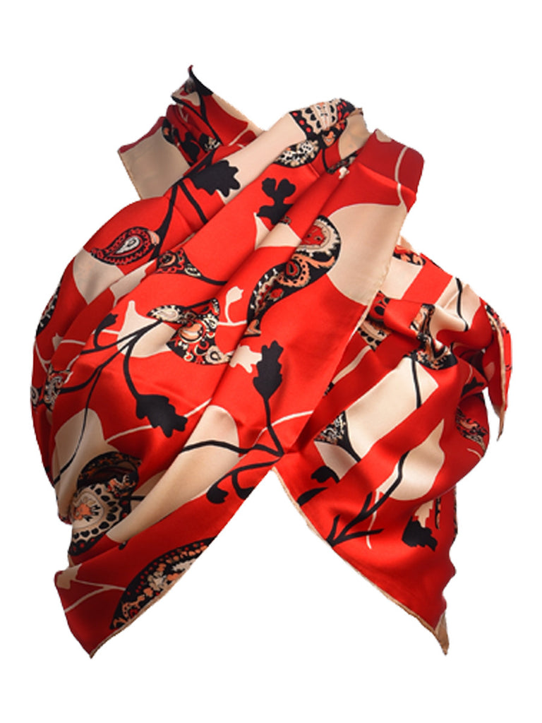 Red silk scarf hosting nature inspired leaves design